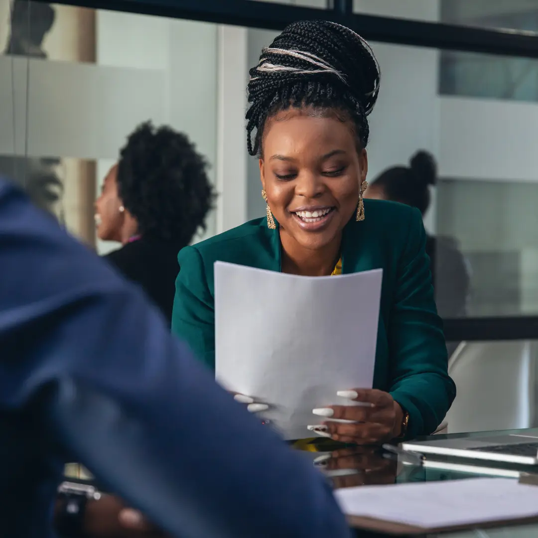 Woman smiling interviewing student
